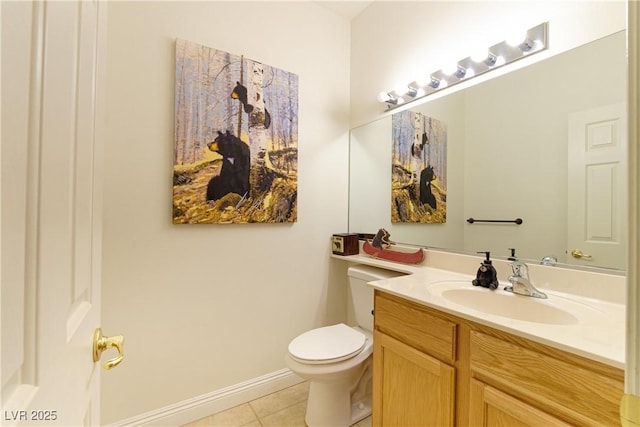 bathroom featuring tile patterned flooring, vanity, and toilet