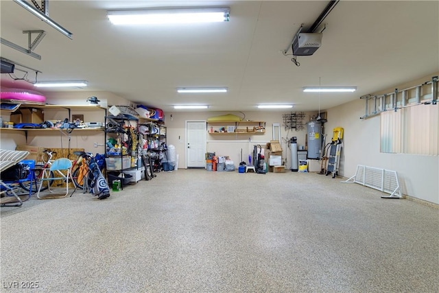 garage featuring a garage door opener and electric water heater