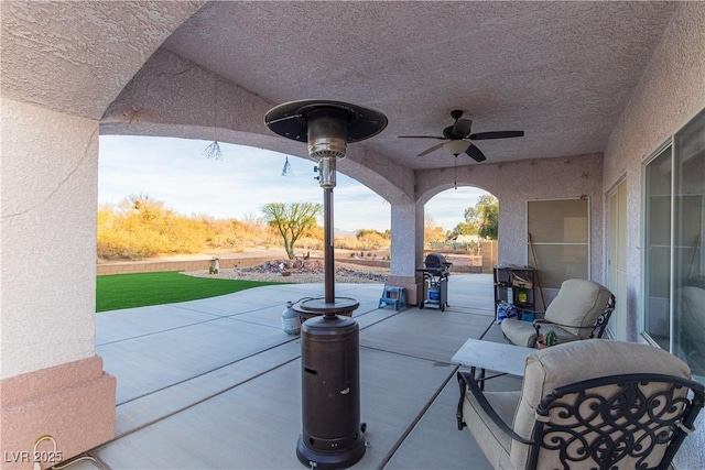 view of patio / terrace featuring a grill and ceiling fan