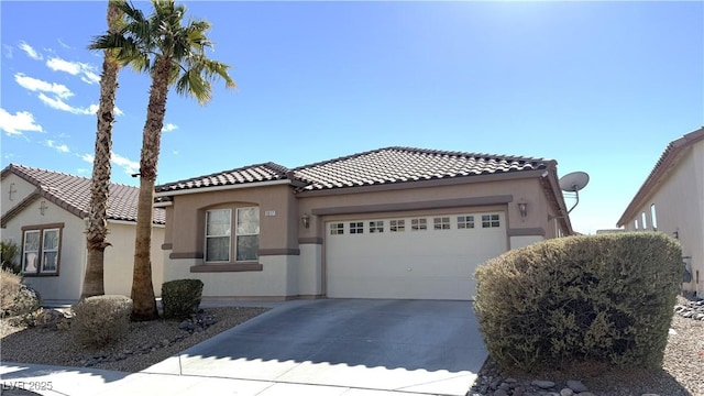 mediterranean / spanish-style house featuring a garage