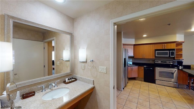 bathroom featuring tile patterned flooring and sink