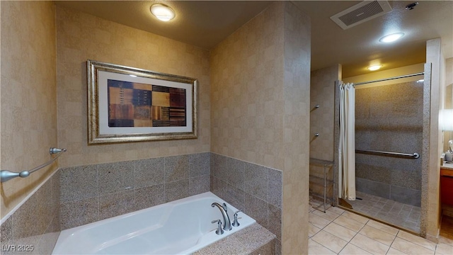 bathroom featuring tile patterned flooring and plus walk in shower