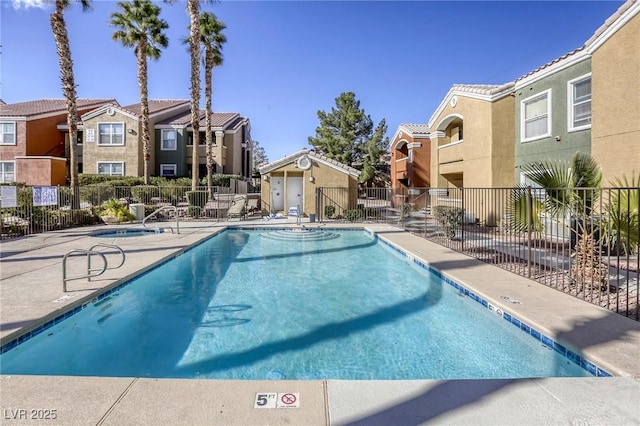 view of swimming pool featuring a patio area