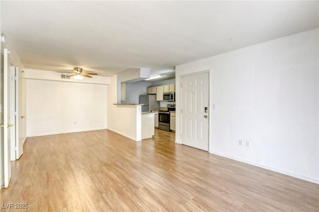 unfurnished living room featuring ceiling fan and light wood-type flooring