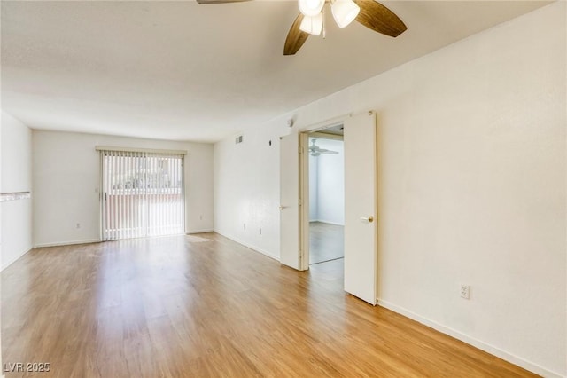 empty room with light hardwood / wood-style floors and ceiling fan