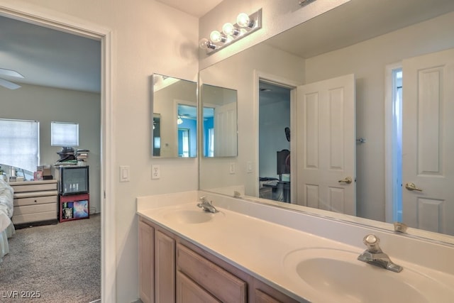 bathroom with ceiling fan and vanity