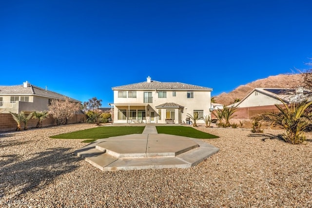 back of property featuring a patio