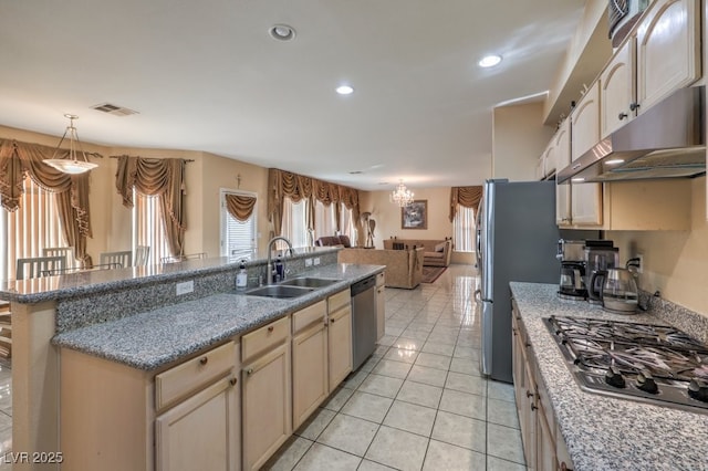 kitchen with pendant lighting, sink, light tile patterned floors, appliances with stainless steel finishes, and a chandelier