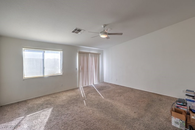 unfurnished bedroom with ceiling fan and carpet