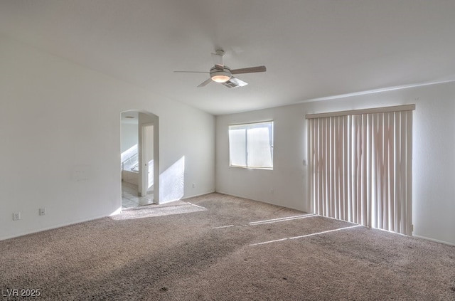 empty room with light colored carpet and ceiling fan