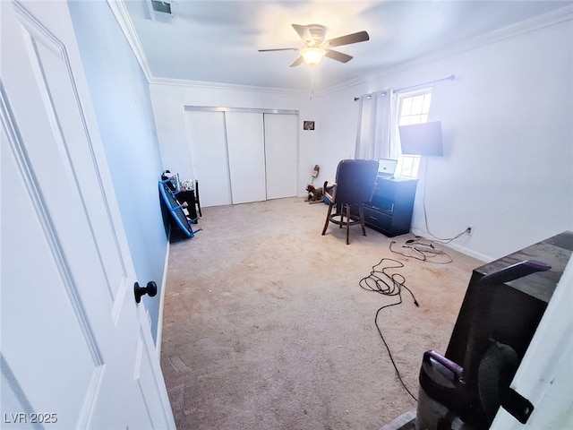 office featuring crown molding, light colored carpet, and ceiling fan