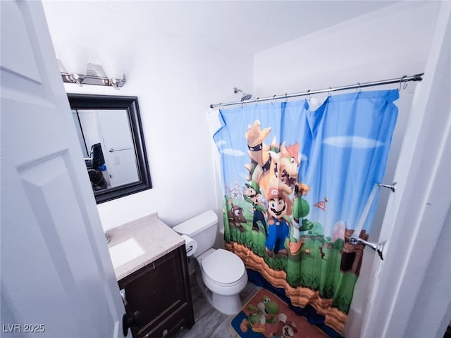 bathroom featuring walk in shower, vanity, and toilet