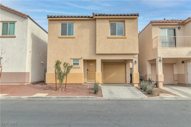 view of front of property featuring a garage and a balcony