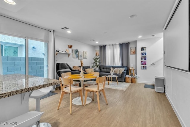 dining space featuring light hardwood / wood-style floors