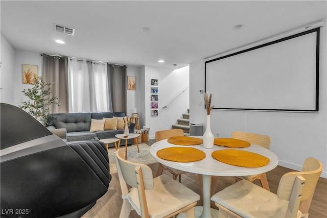 dining space with light hardwood / wood-style floors