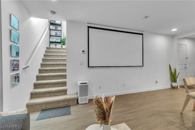 cinema featuring hardwood / wood-style flooring