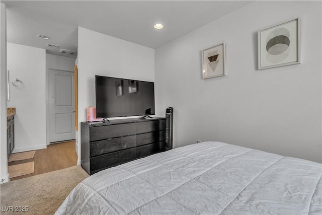 bedroom with light hardwood / wood-style flooring