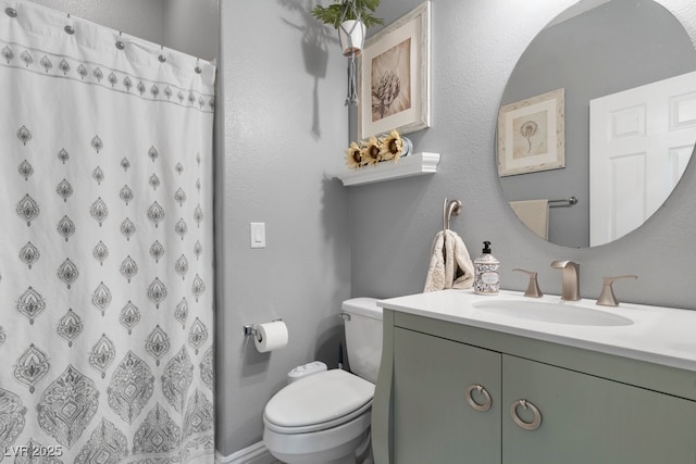 bathroom with vanity, toilet, and a shower with shower curtain