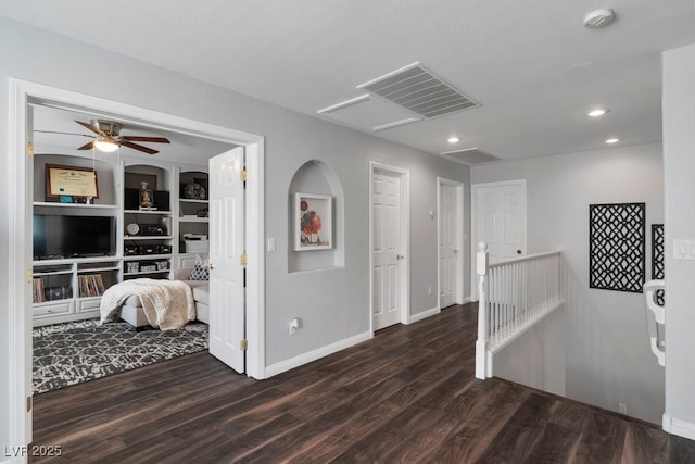 corridor with dark hardwood / wood-style floors