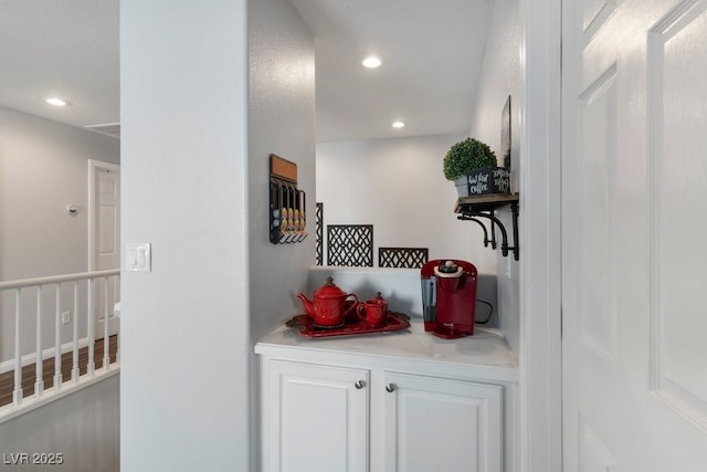 bar with white cabinetry