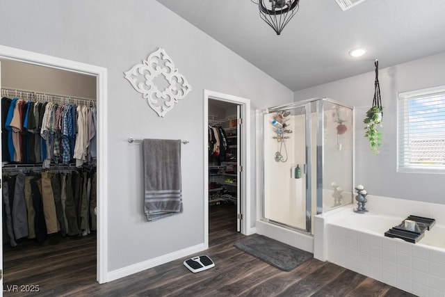 bathroom featuring separate shower and tub, hardwood / wood-style floors, and lofted ceiling