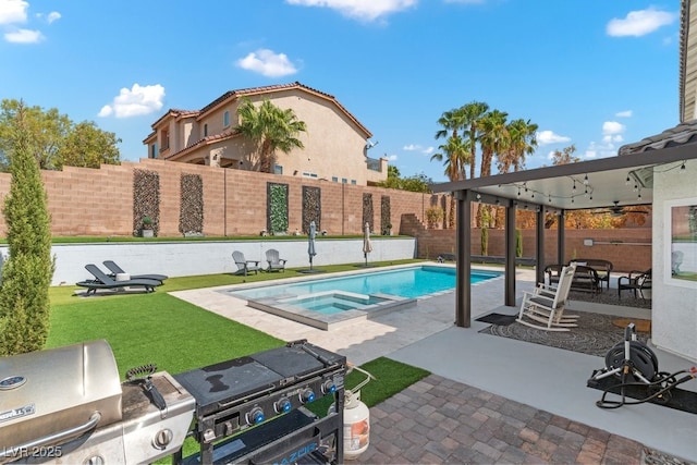 view of swimming pool featuring an outdoor kitchen, grilling area, an in ground hot tub, ceiling fan, and a patio