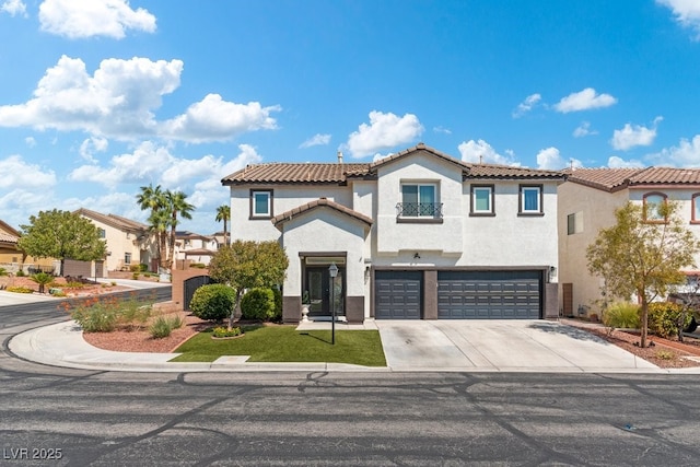 mediterranean / spanish house featuring a garage