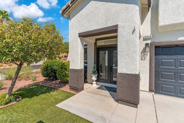 doorway to property featuring a lawn