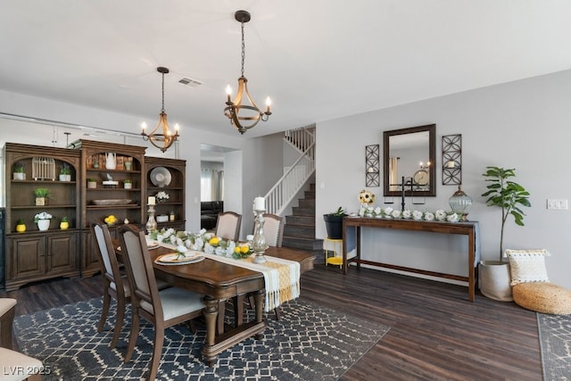 dining area featuring dark wood-type flooring