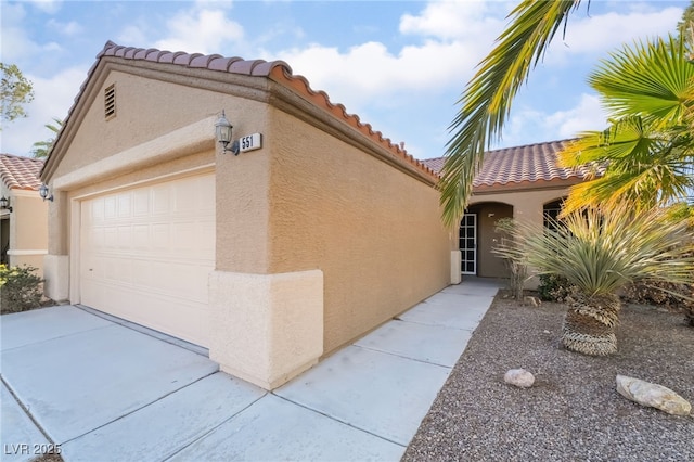 mediterranean / spanish-style house featuring a garage