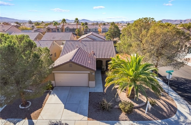 birds eye view of property with a mountain view