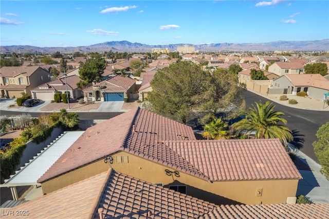 birds eye view of property with a mountain view