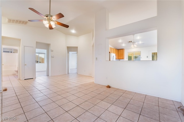 unfurnished room featuring light tile patterned floors, high vaulted ceiling, and ceiling fan