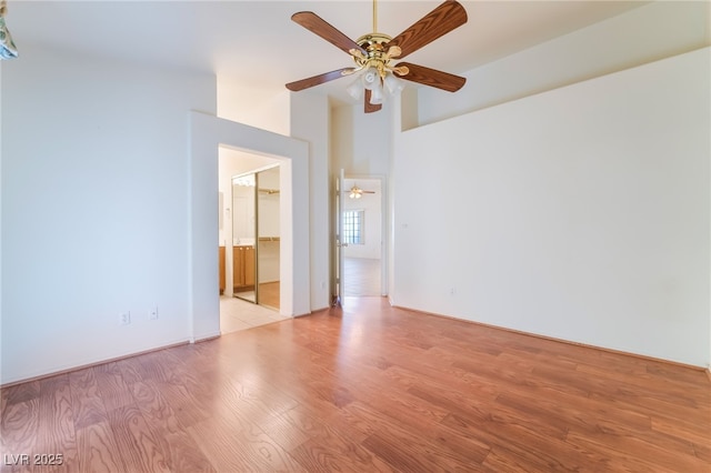 spare room with light hardwood / wood-style flooring and ceiling fan