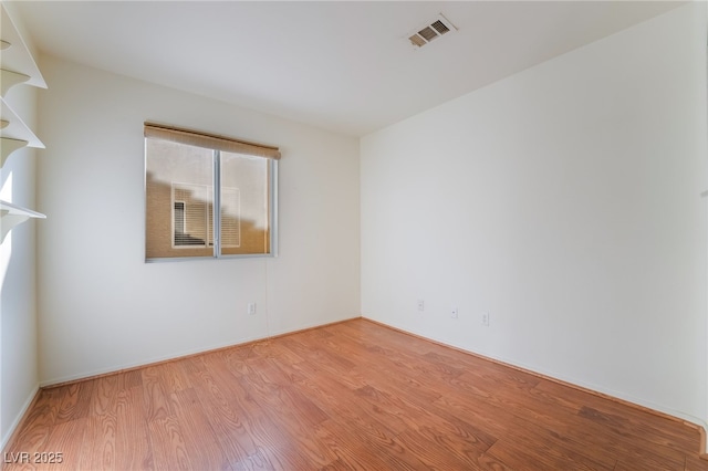 unfurnished room featuring light wood-type flooring