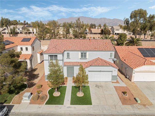 view of front of house featuring a mountain view and a garage