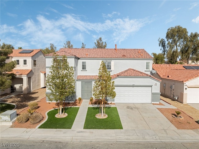 mediterranean / spanish home featuring a garage