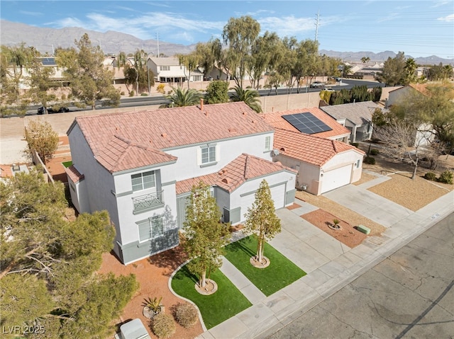 birds eye view of property featuring a mountain view