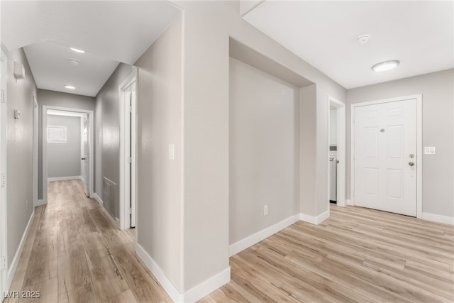 hallway with light wood-type flooring