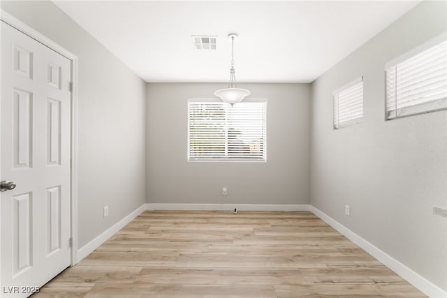 interior space with a healthy amount of sunlight and light hardwood / wood-style flooring