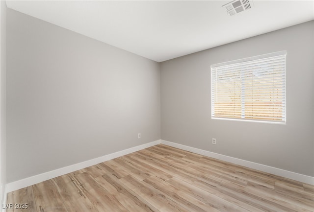 empty room with light wood-type flooring