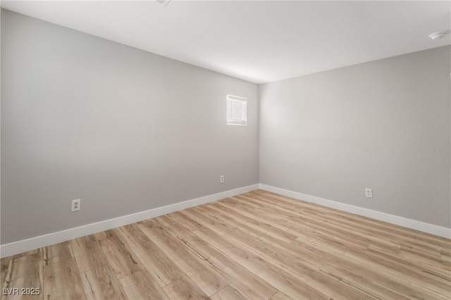 spare room featuring light hardwood / wood-style floors