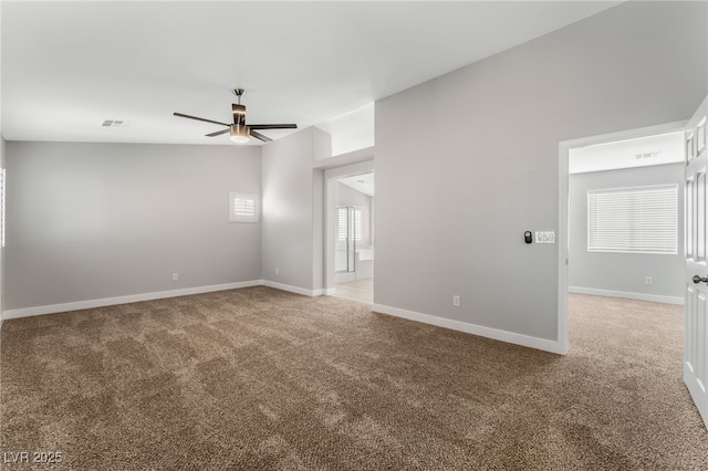 carpeted empty room with ceiling fan