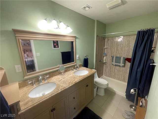 bathroom with vanity, tile patterned floors, and toilet