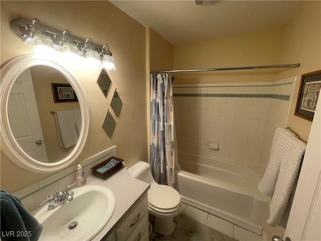 full bathroom with vanity, toilet, and shower / bath combo