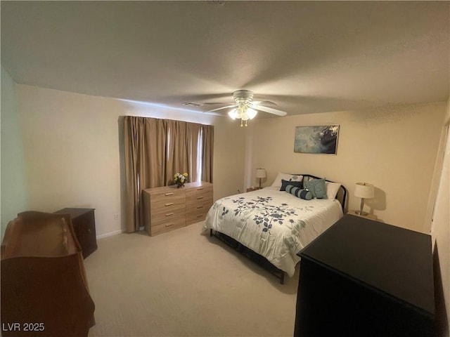 bedroom featuring light carpet and ceiling fan