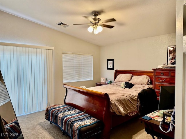 carpeted bedroom featuring lofted ceiling and ceiling fan