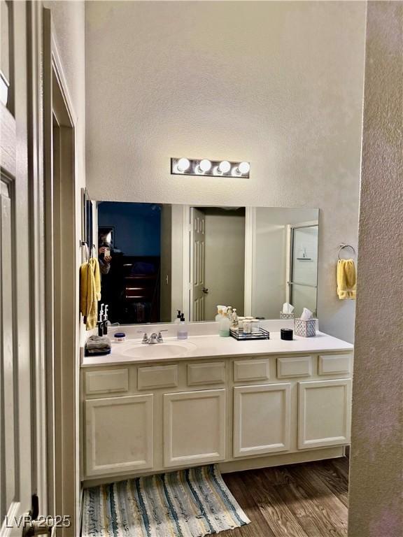 bathroom featuring vanity and wood-type flooring