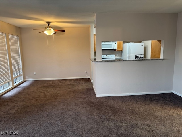 unfurnished living room featuring ceiling fan and dark colored carpet