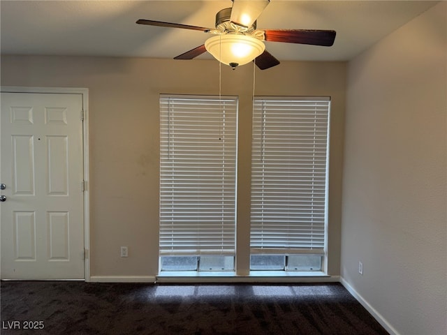 interior space with ceiling fan